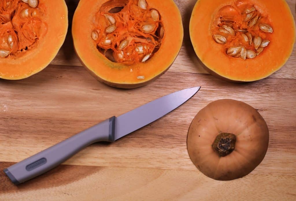 knife and cut butternut squash on cutting board