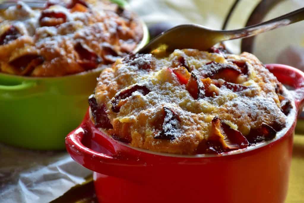 plum cake in red bowl
