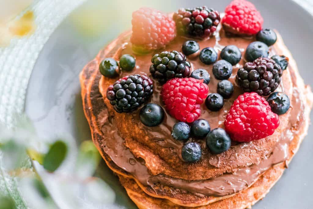 Pancakes with raspberry and blueberry toppings