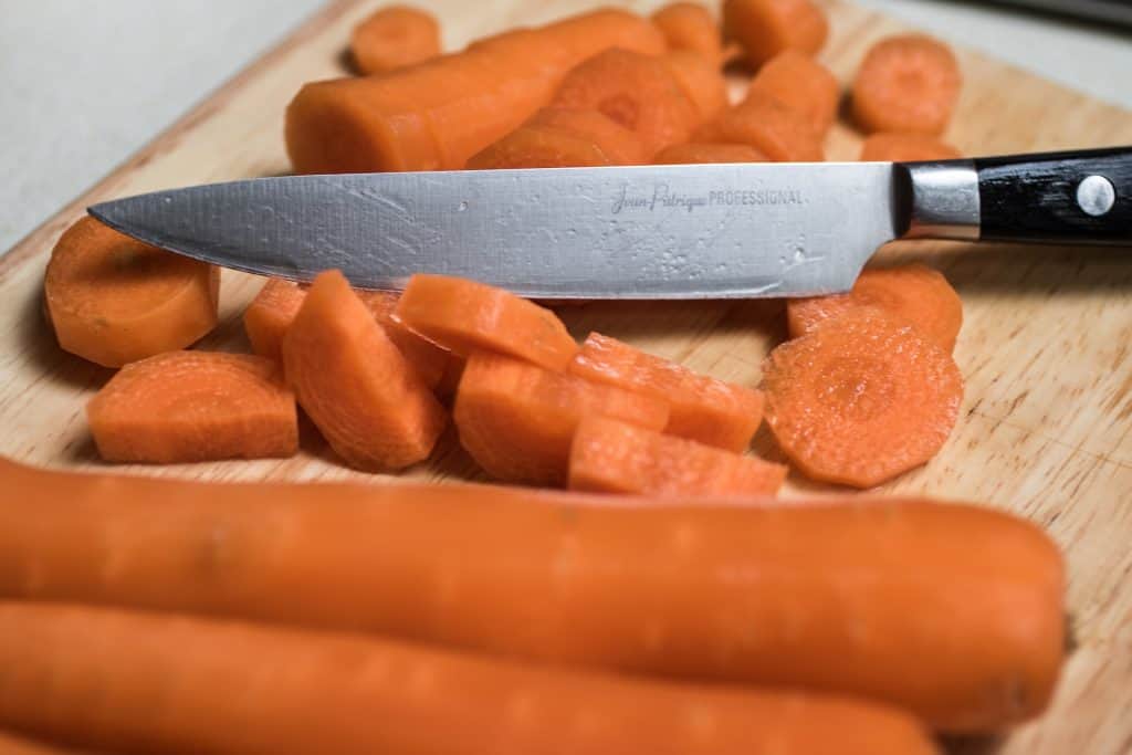 carrots and knife on cutting board