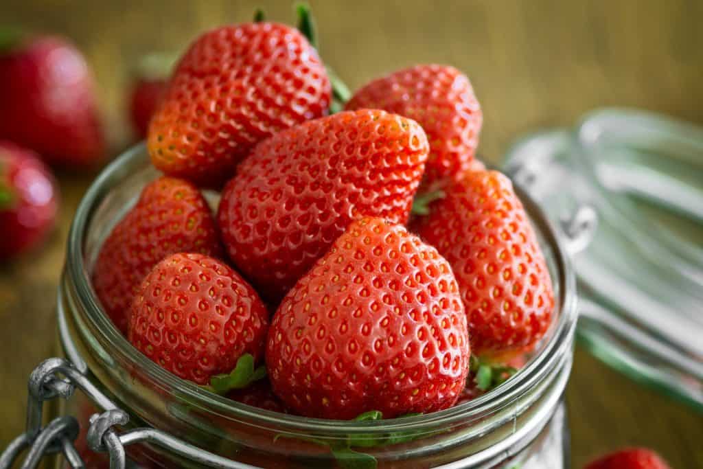 strawberries packed in mason jar