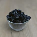 prunes in a small glass bowl
