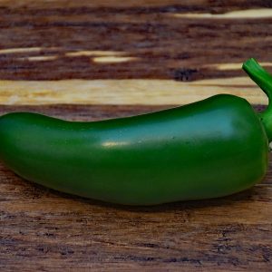 jalapeno pepper on wooden cutting board