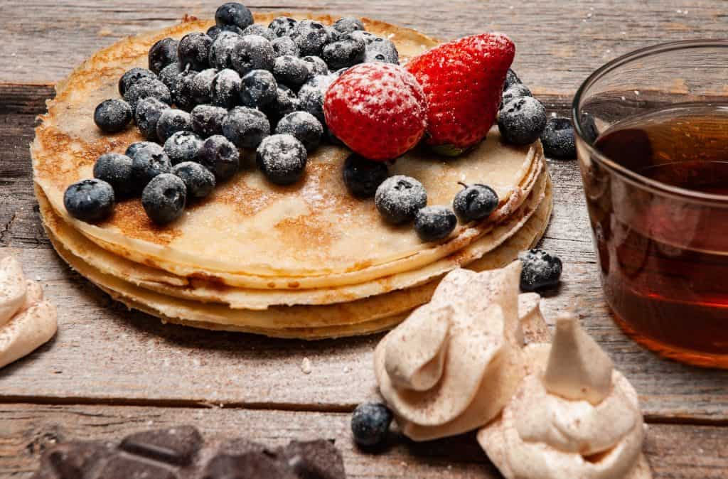 sugared berries on pancakes